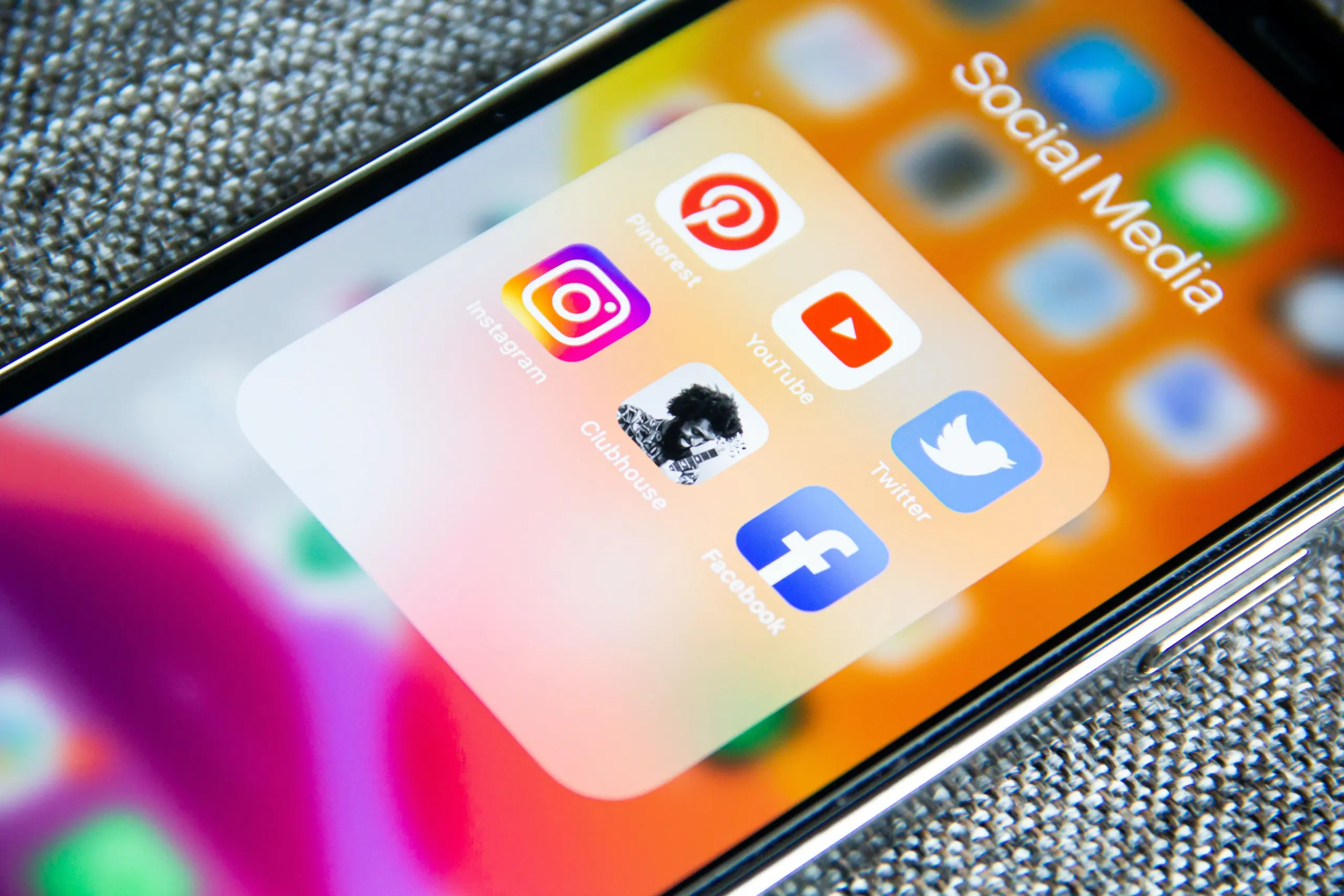 A smartphone with multiple Social Media apps icons on the screen