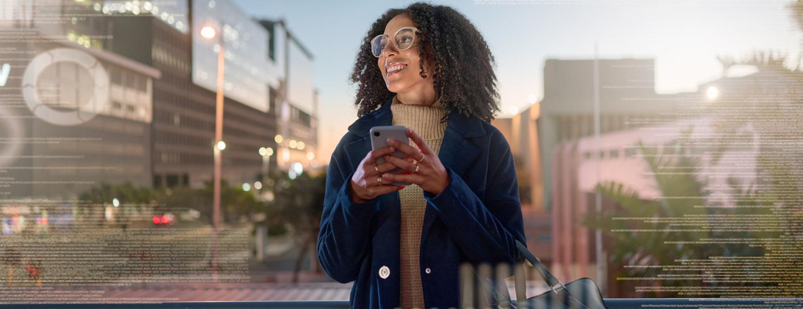 A woman using her smartphone in the city, representing how AI in local SEO delivers real-time, location-based results.